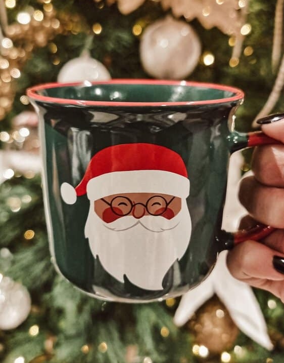Santa mug in front of a Christmas tree